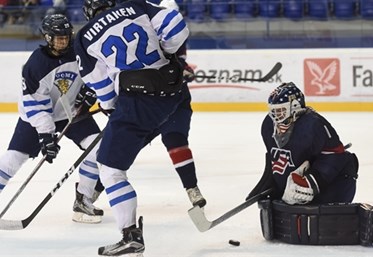 POPRAD, SLOVAKIA - APRIL 23: USA's Dylan St. Cyr #1 makes a save while Finland's Jesse Ylonen #29 and Santeri Virtanen #22 look on during gold medal game action at the 2017 IIHF Ice Hockey U18 World Championship. (Photo by Andrea Cardin/HHOF-IIHF Images)